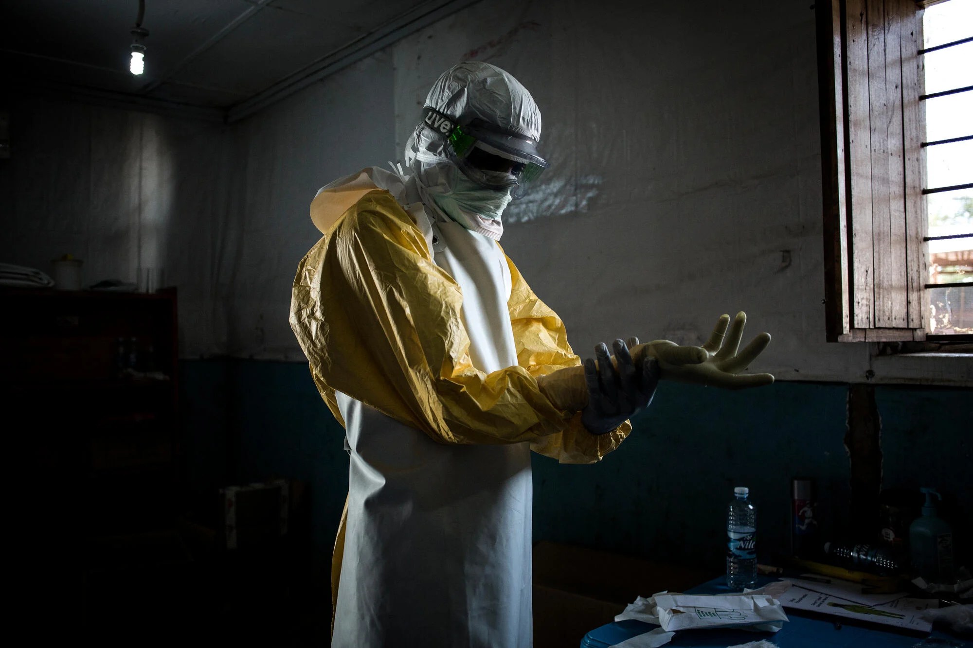 Health workers in protective equipment at an Ebola treatment facility